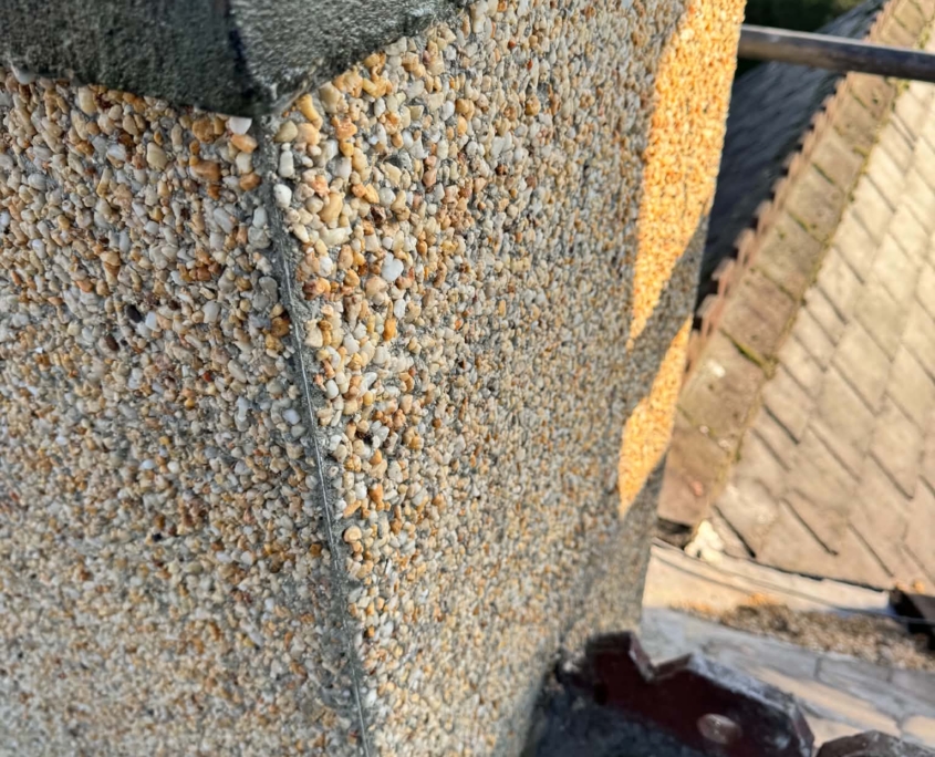 Chimney Pebble Dashing Job in West Yorkshire (4) Restored chimney stack with new pebble dash and smooth rendered chimney crown in Calverley West Yorkshire.